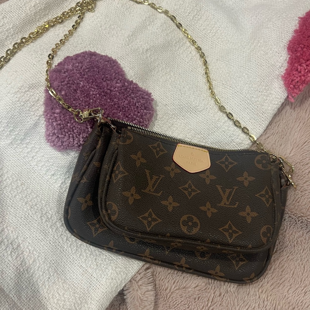 Sold locally Louis Vuitton Monogram pouchette Crossbody